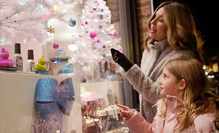 woman and girl window shopping
